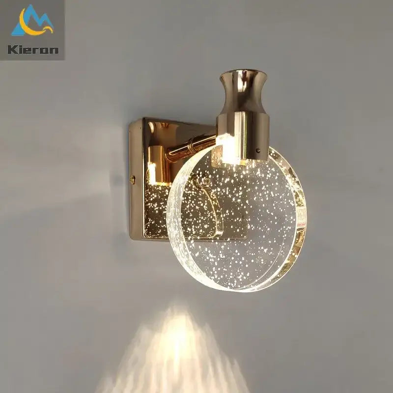 Modern gold crystal led wall lamp featuring a glass globe sconce with embedded sparkling particles for elegant decorbites crystal led lighting