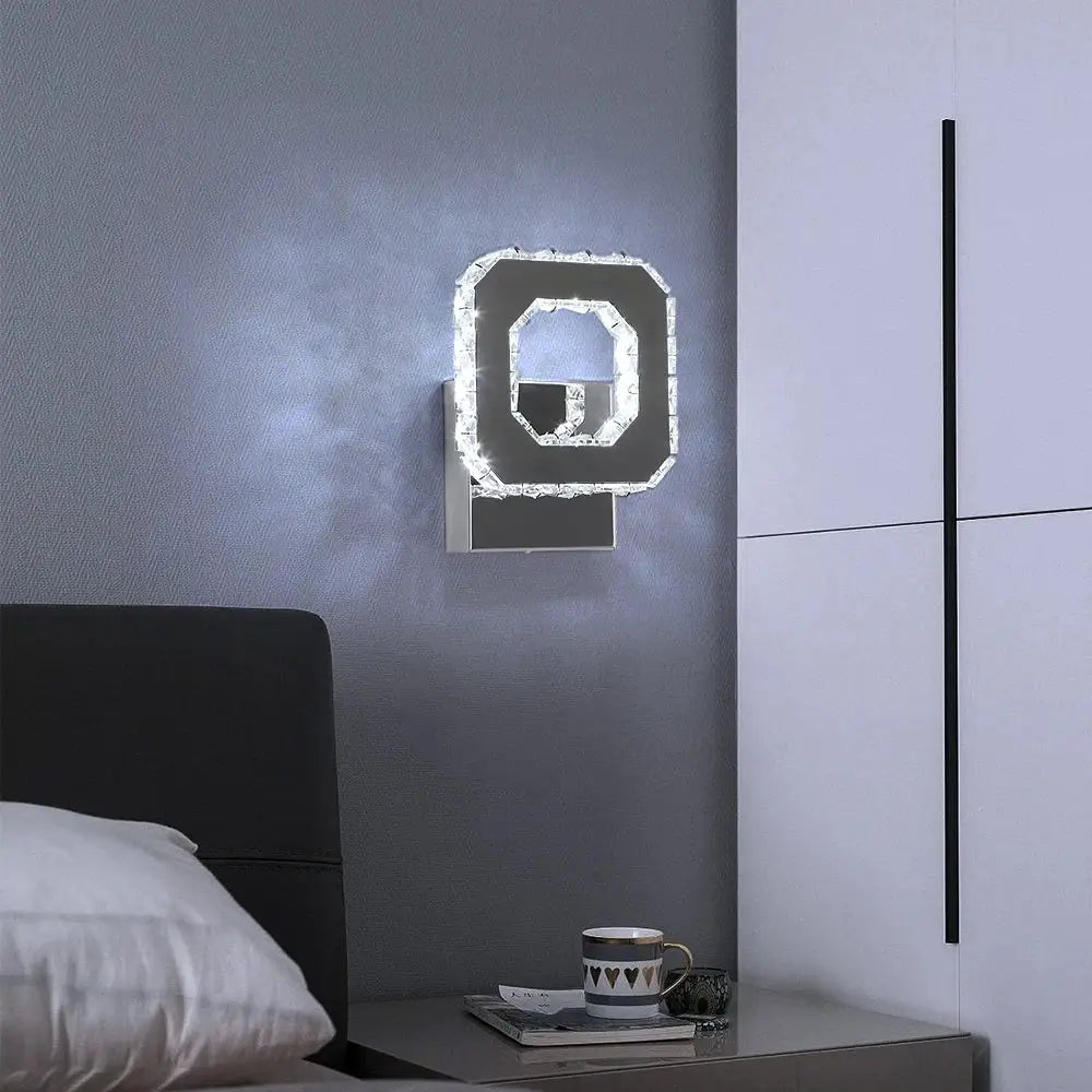 Modern geometric wall lamp with sleek black frame and sparkling crystal accents from decorbites crystal led collection