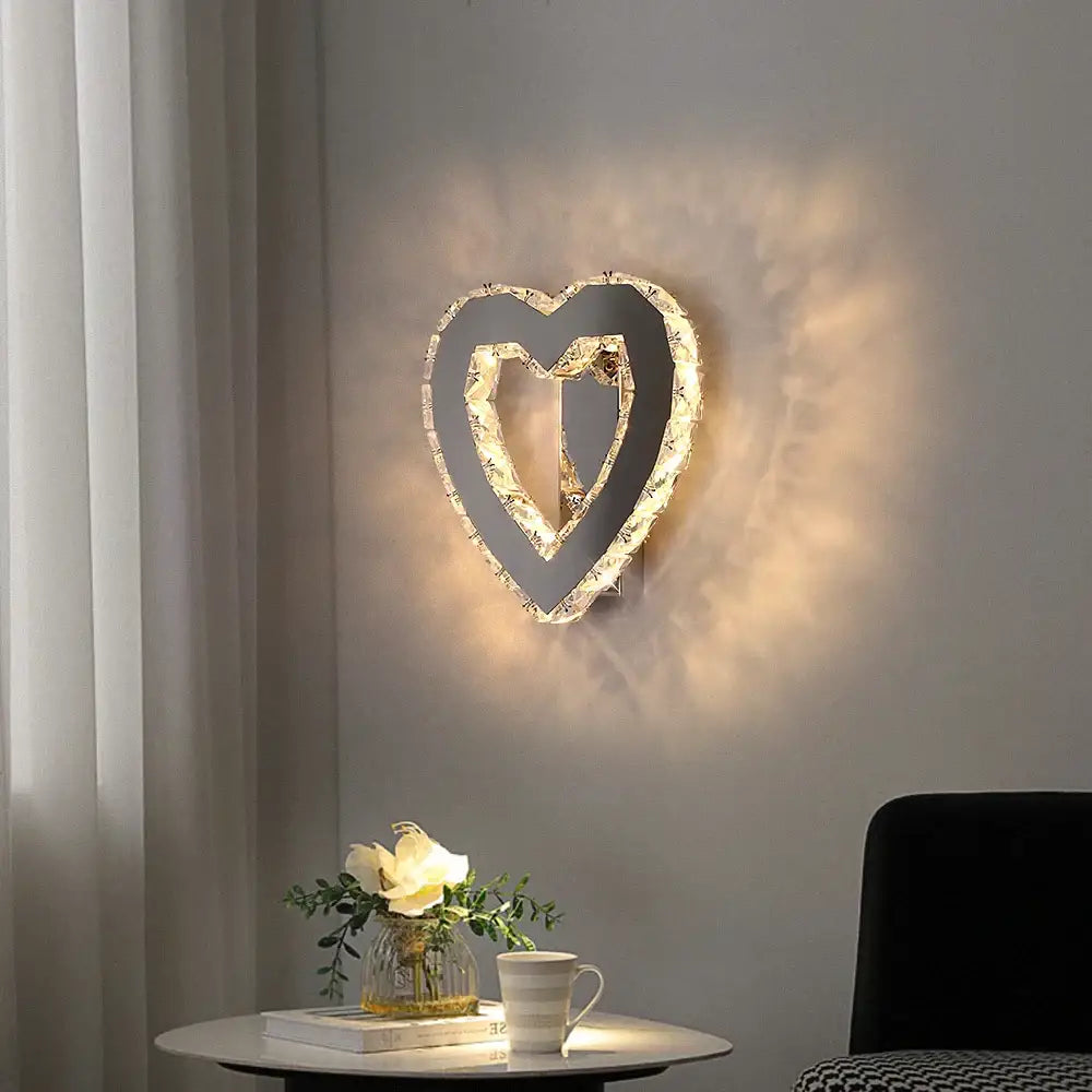 A modern gold crystal led wall lamp with a sleek black frame and decorbites crystal led for bedroom sconce decor