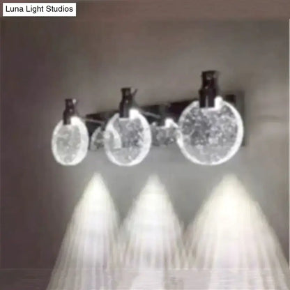 Modern gold crystal led wall lamp featuring three circular simple crystal led globes with black fixtures emitting bright light