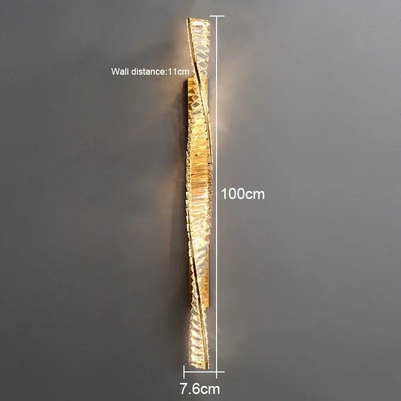 Modern gold crystal led wall lamp with a sleek metallic frame and cascading crystals for luxury bedroom lighting decorbites crystal led