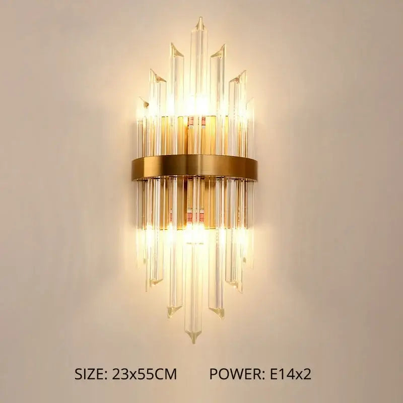 Modern gold crystal led wall lamp featuring a gold-toned cascade of clear crystal prisms in a sunburst design for bedroom use