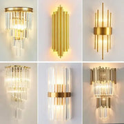 Modern gold crystal led wall lamps featuring gold-toned sconces with cascading clear glass rods for bedroom lighting