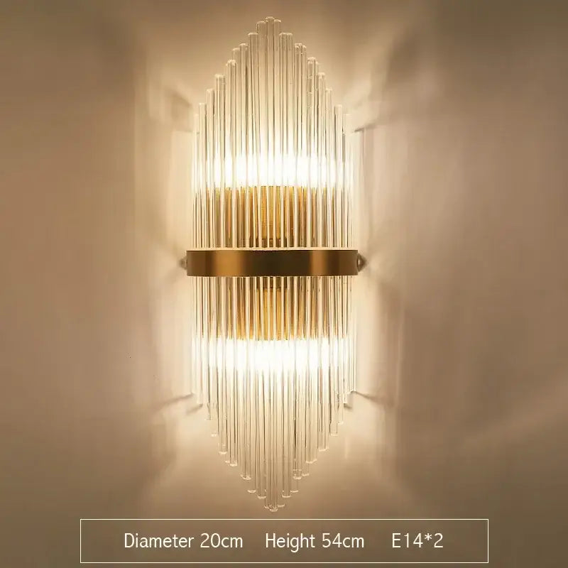 Modern gold crystal led wall sconce with clear glass rods in a vertical radiating pattern for bedroom lighting
