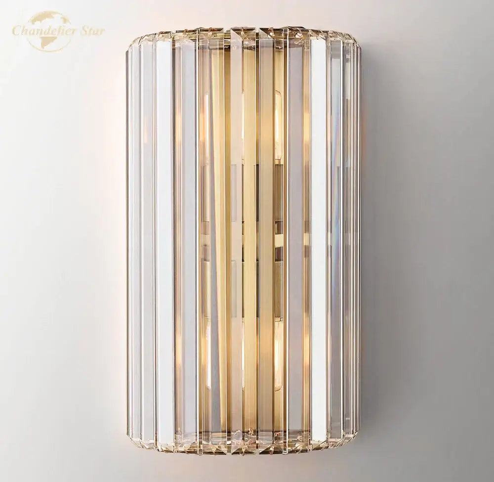 Modern gold crystal led wall sconce with vertical crystal rods and polished brass accents for bedroom lighting decorbites crystal led