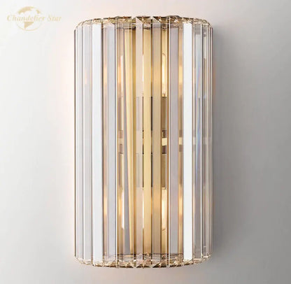 Modern gold crystal led wall sconce with vertical crystal rods and polished brass accents for bedroom lighting decorbites crystal led