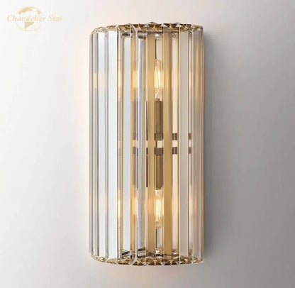 Modern gold crystal led wall sconce with vertical crystal rods and filament bulbs for bedroom lighting decorbites crystal led