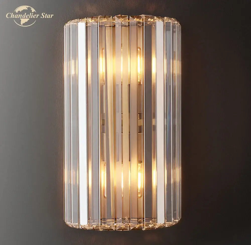 Modern gold crystal led wall sconce with vertical faceted glass rods and warm bulbs for bedroom lighting decorbites crystal led