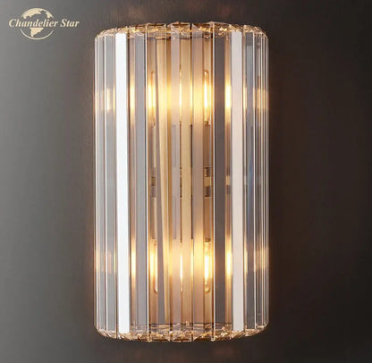 Modern gold crystal led wall sconce with vertical faceted glass rods and warm bulbs for bedroom lighting decorbites crystal led