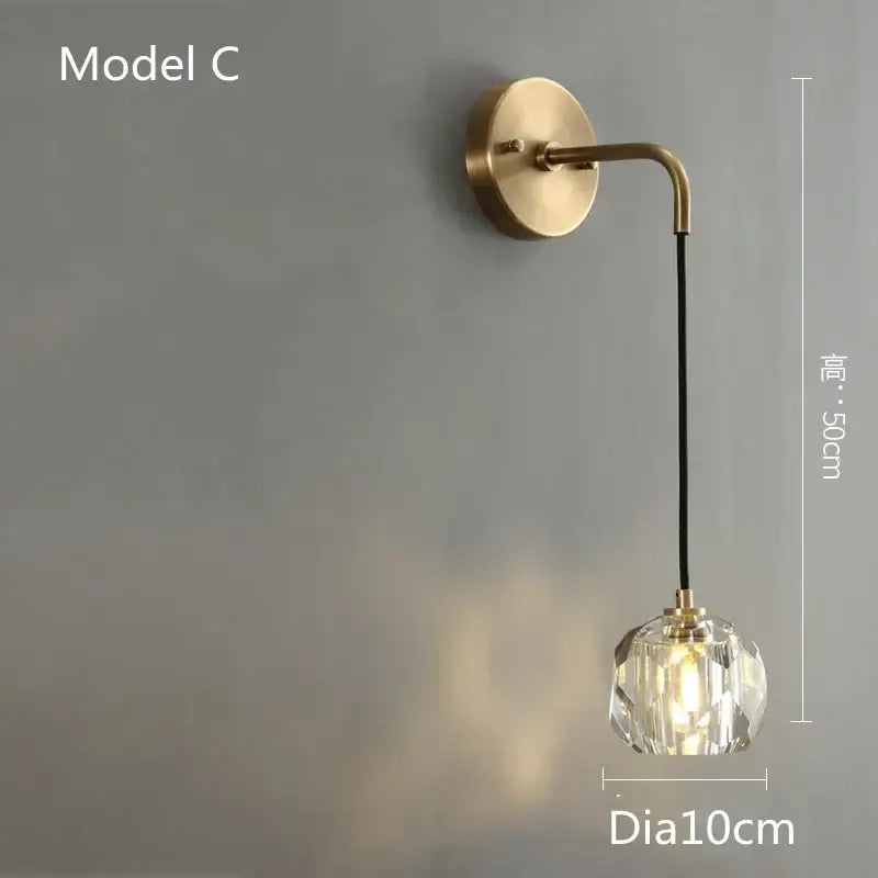 Modern gold crystal led wall sconce with brass finish curved arm and faceted globe for luxury decorbites crystal led decor
