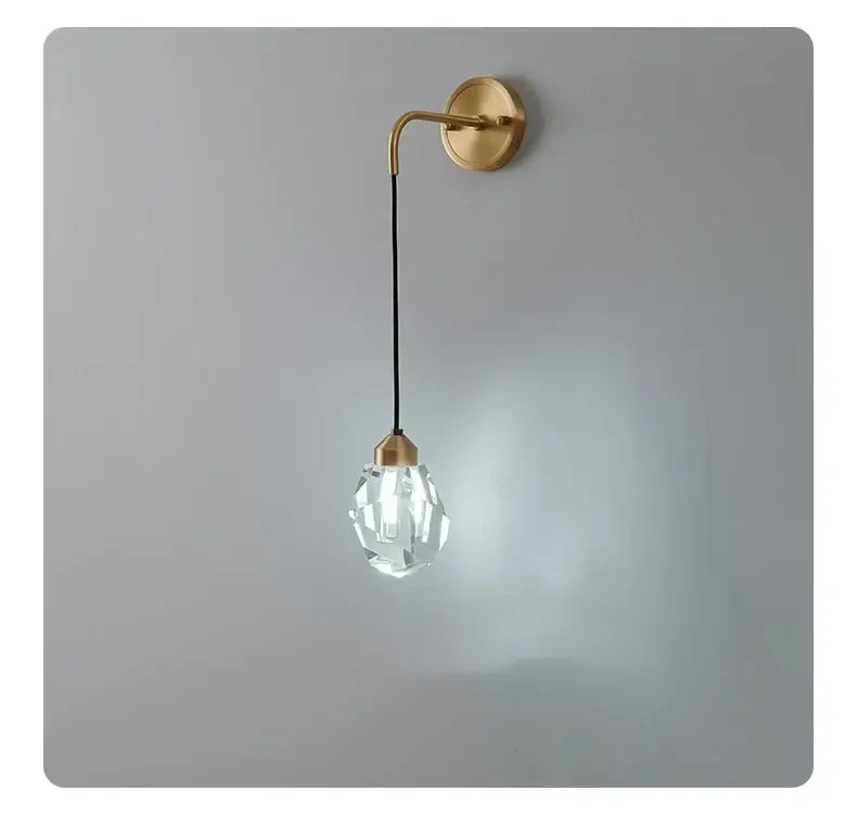 Modern gold crystal led wall sconce with clear faceted crystal pendant and gold metal arm for luxury bedroom decorbites crystal led