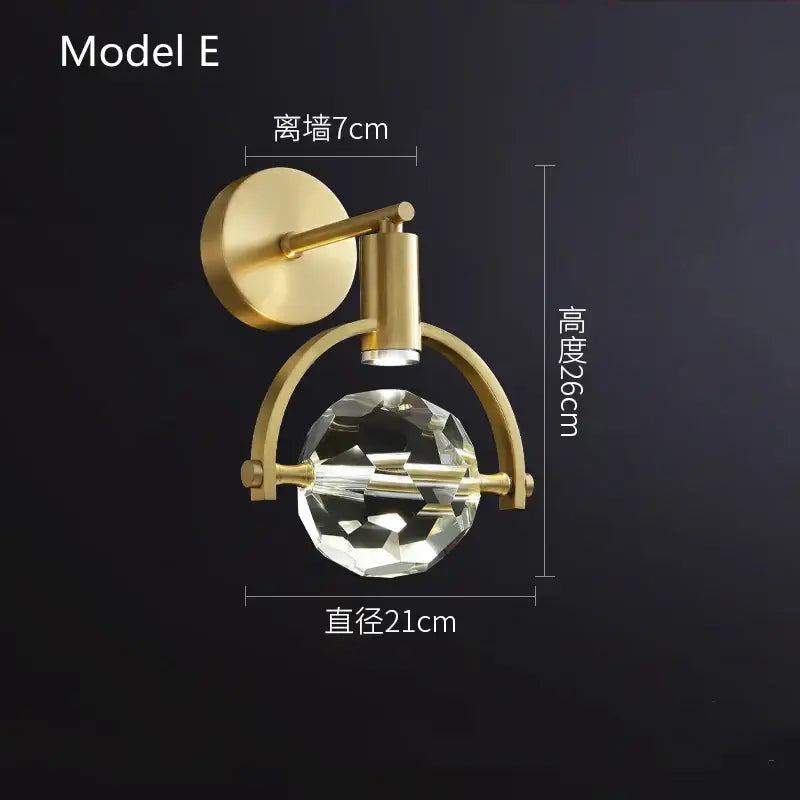 Modern gold crystal led wall sconce with faceted globe and arched metal frame for luxury bedroom decorbites crystal led
