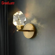 Modern gold crystal led wall sconce with faceted globe on brass base for bedroom luxury decorbites crystal led lighting