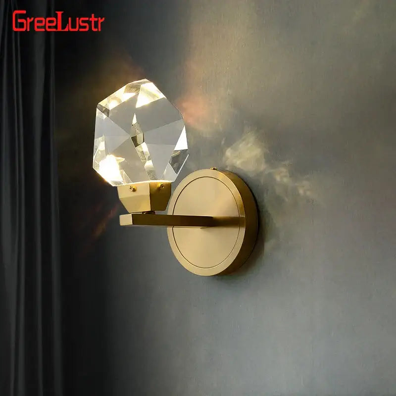 Modern gold crystal led wall sconce with faceted globe on brass base for bedroom luxury decorbites crystal led lighting