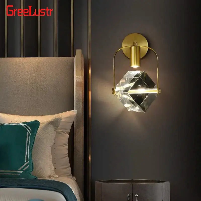 Modern gold crystal led wall sconce with a faceted globe and brass accents for luxury bedroom decorbites crystal led lighting
