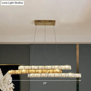 Decorbites gold linear island pendant light with clear crystal accents features three horizontal tiers with led minimalist design
