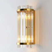 Elegant modern gold wall lamp with vertical crystal rods showcasing decorbites crystal luxury for bedroom sconce decor