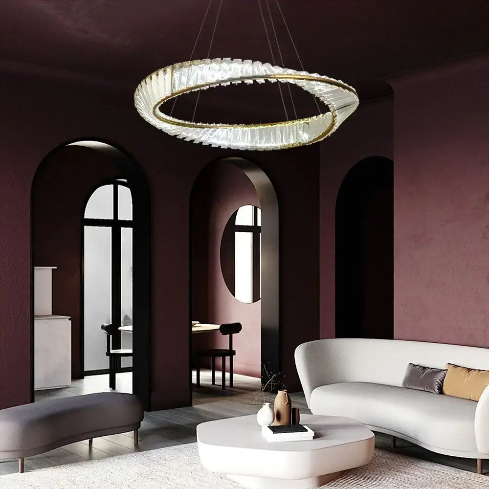Modern gold crystal möbius strip pendant chandelier with clear crystal rings and gold-toned frame decorbites gold