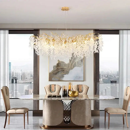 Modern gold crystal money tree chandelier with leaf-like crystal droplets on a central golden frame for living room decor