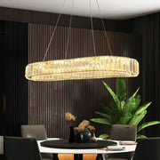 Modern gold crystal oval led chandelier with crystal-like glass panels and golden glow for living room decorbites crystal oval