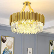 Modern gold crystal oval round chandelier with vertical metallic bars and cascading clear crystal prisms for dining room decorbites crystal oval