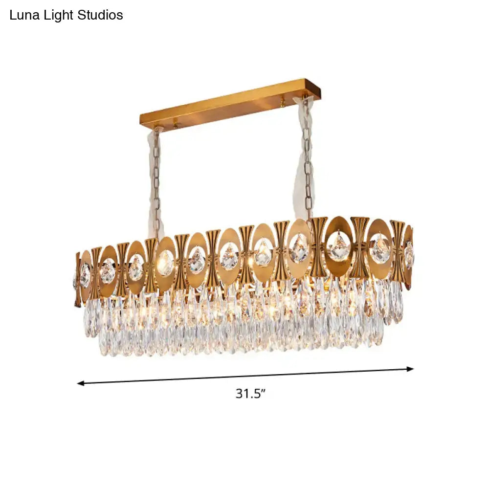 Modern gold crystal oval suspension island pendant light with rectangular frame and cascading faceted crystal droplets