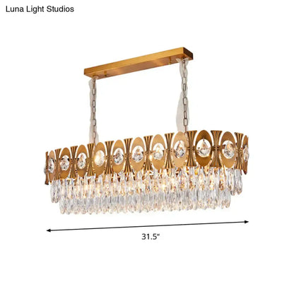 Modern gold crystal oval suspension island pendant light with rectangular frame and cascading faceted crystal droplets