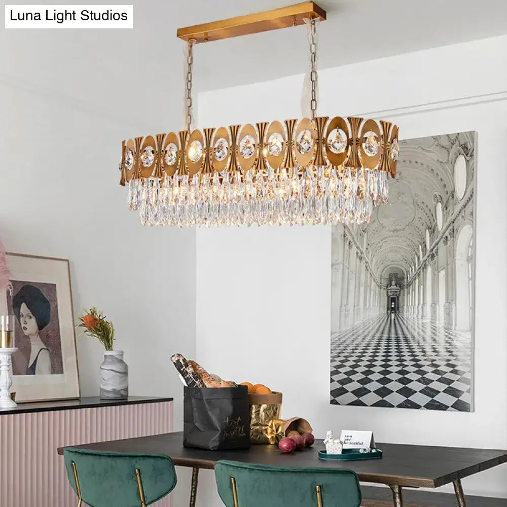 Modern gold crystal oval suspension island pendant light with gold-toned rectangular frame and crystal droplets