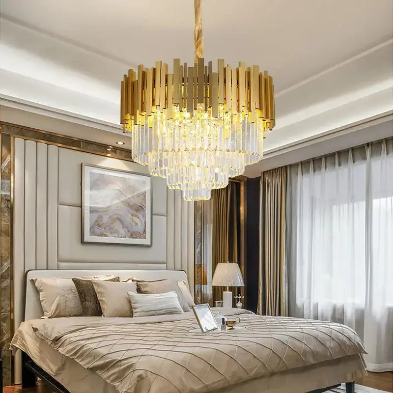 Modern gold crystal pendant chandelier with tiered droplets features a gold-toned crystal pendant chandelier decorbites design