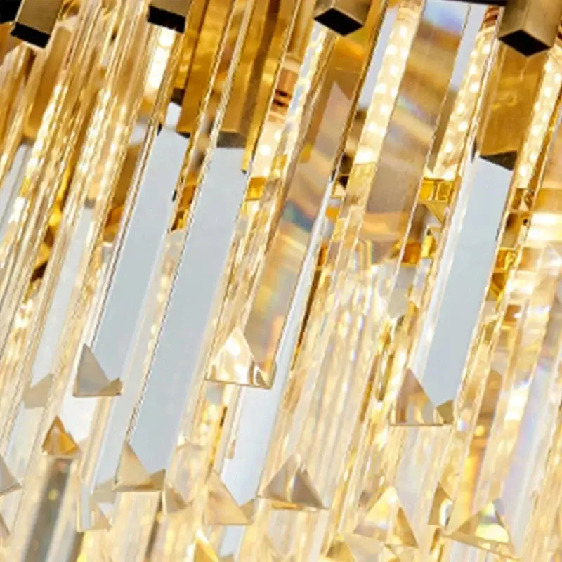 Modern gold crystal pendant chandelier with faceted prisms and metallic accents for elegant dining room decorbites crystal pendant
