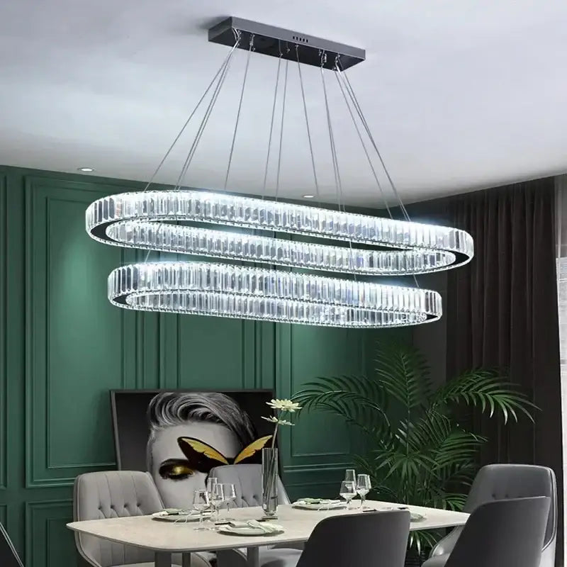 Modern gold decorbites crystal pendant chandelier featuring double-ring crystal design with sleek metallic frame for dining room decor