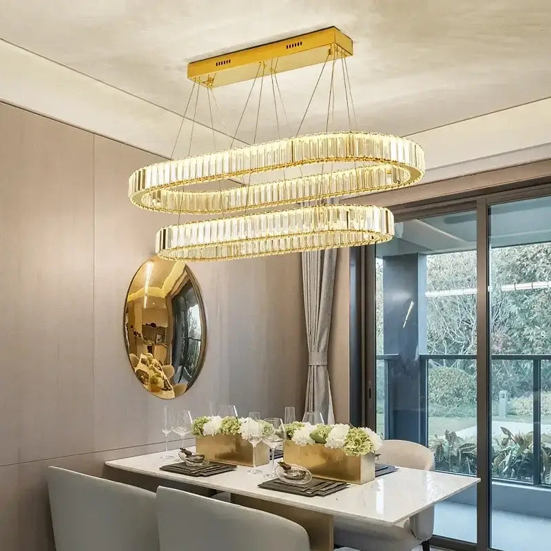 Modern gold crystal pendant chandelier featuring a gold-toned double-ring design with faceted crystal accents decorbites crystal pendant