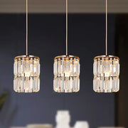 Three elegant gold-toned crystal pendant lights with metal frames and rods modern pendant light for dining room