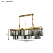Decorbites modern gold pendant light with rectangular frame and cascading clear crystal prisms suspended by twisted ropes