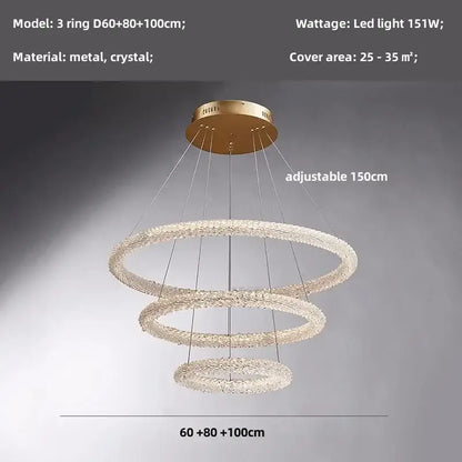 Modern gold crystal pendant lights featuring a gold-toned three-ring chandelier with crystal-encrusted rings and metallic mount