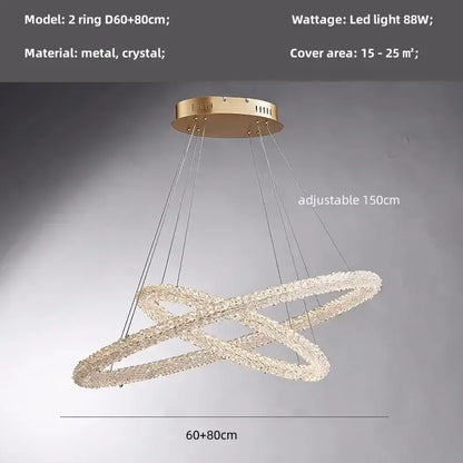 Modern gold crystal pendant lights featuring gold-toned metal and adjustable crystal double-ring design for dining rooms
