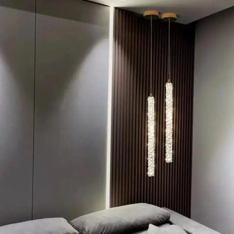 Two elegant gold crystal pendant lights with wooden mounts for luxury dining room decorbites crystal pendant lighting