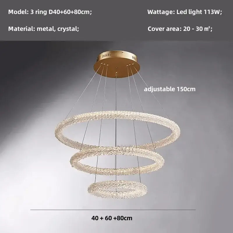 Modern gold crystal pendant lights featuring a gold-toned three-ring chandelier with crystal pendant lights decorbites design