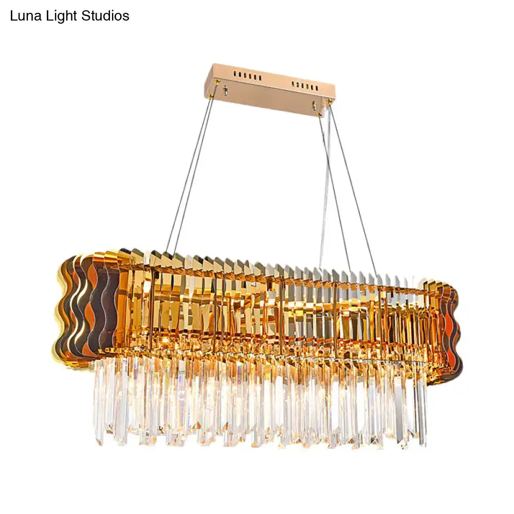 DecorBites modern crystal prism island pendant with gold finish featuring layered wavy glass panels and dangling prisms