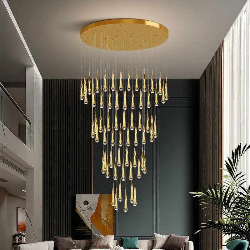 Modern gold crystal raindrop pendant lights featuring a golden circular chandelier with cascading teardrop glass pendants