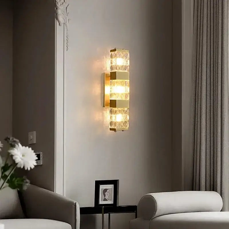 Modern gold crystal rectangle wall lamp with stacked textured glass panels emitting warm glow for luxury decorbites crystal rectangle wall lighting