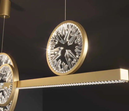 Modern gold crystal ring chandelier pendant light with faceted crystal elements and a crystal-embedded horizontal bar