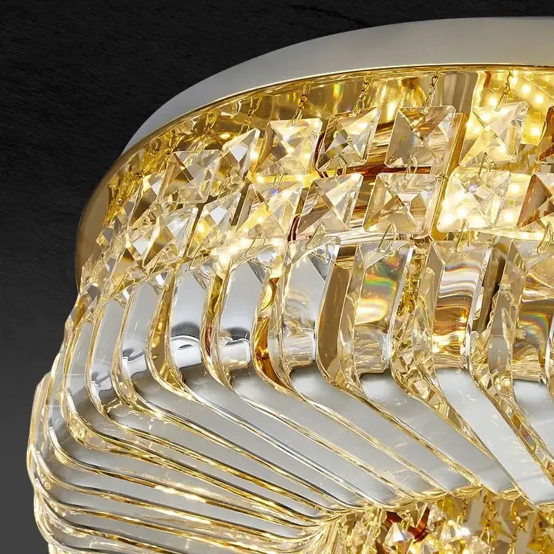 Modern gold crystal ring led ceiling lamp featuring a gold-toned crystal ring led chandelier with layered curved glass decorbites crystal ring