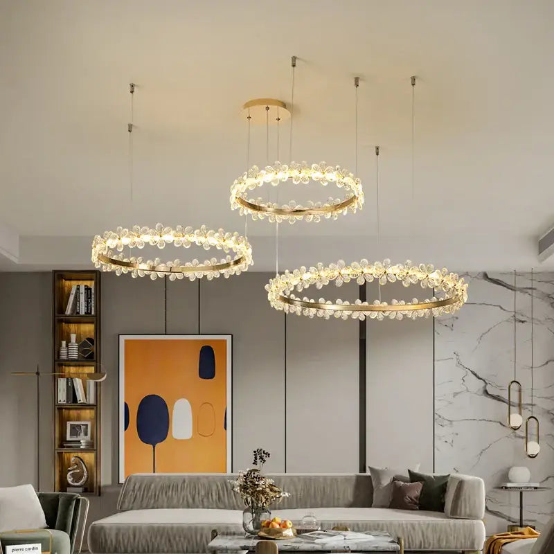 Three elegant gold-toned decorbites crystal ring led chandeliers with crystal droplets for modern dining room decor