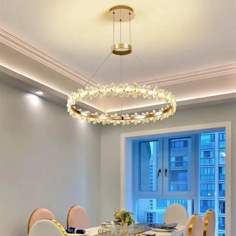 Modern gold crystal ring led chandelier featuring clear flower-shaped crystals for elegant dining room decorbites crystal ring