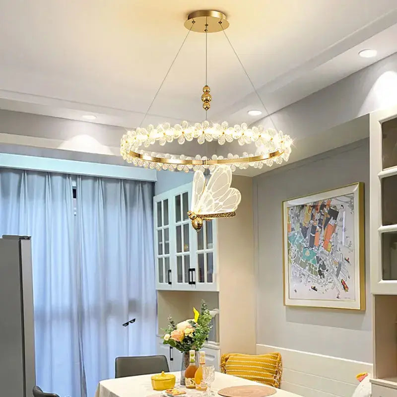 Modern gold crystal ring led chandelier with clear crystal droplets and illuminated butterfly pendant for dining room decorbites crystal ring