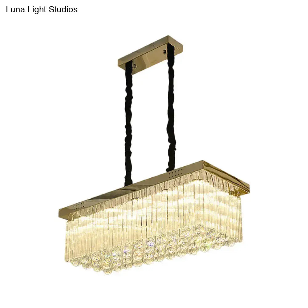 Gold-toned DecorBites LED rectangular chandelier with cascading crystal rods and warm white lighting for dining room