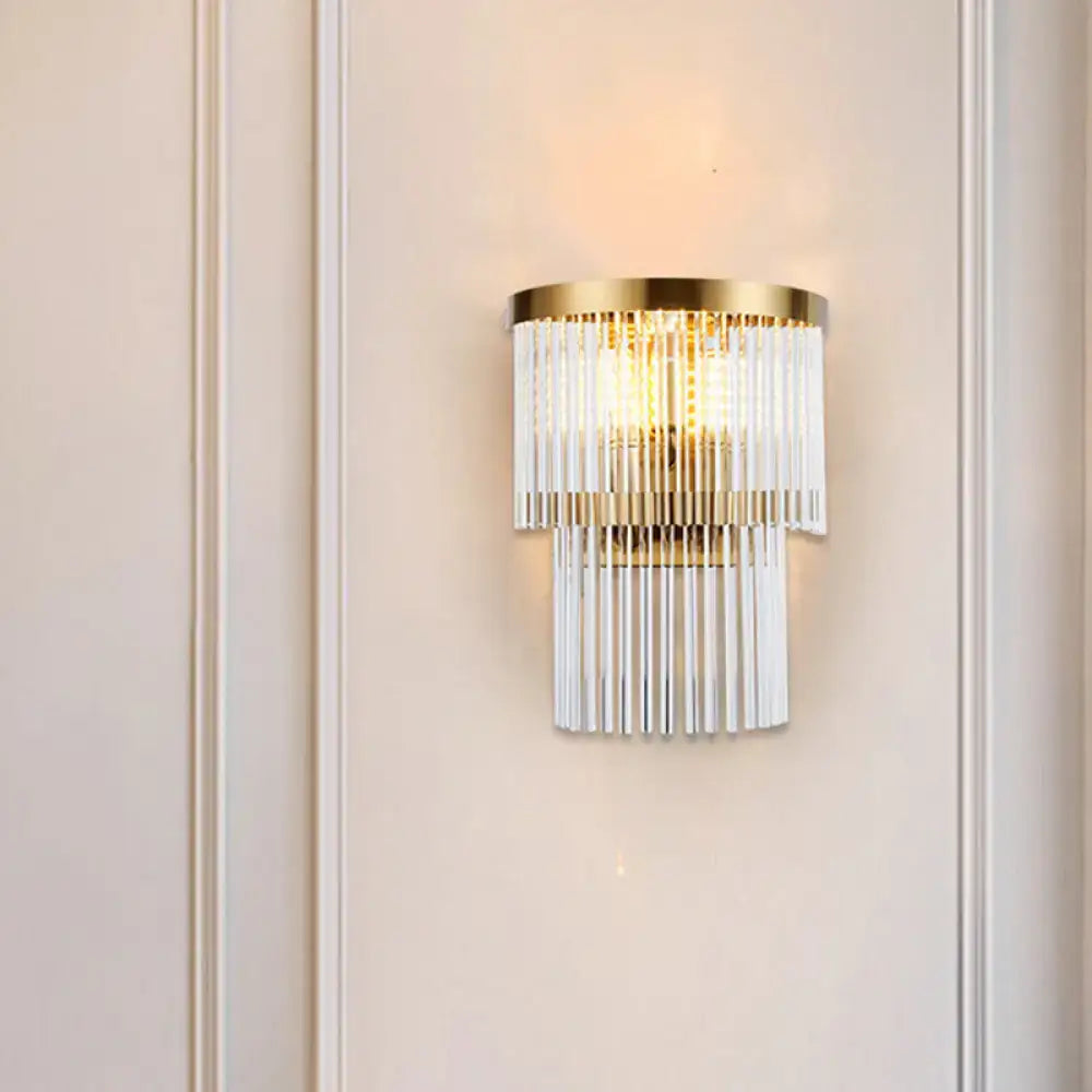 Modern gold wall lamp with cascading clear crystal rods for elegant dining room lighting