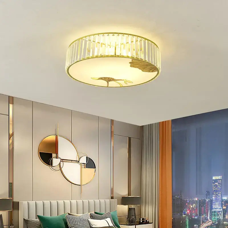 Modern gold crystal round ceiling light with vertical crystal accents and lotus leaf motif for bedroom decorbites crystal round