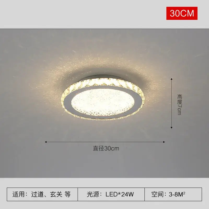 Modern gold crystal round led ceiling light with sleek chrome frame and decorbites crystal round accents emitting warm white illumination